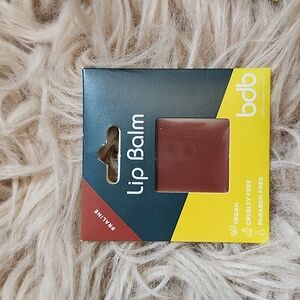 billion dollar brow lip balm. color praline.